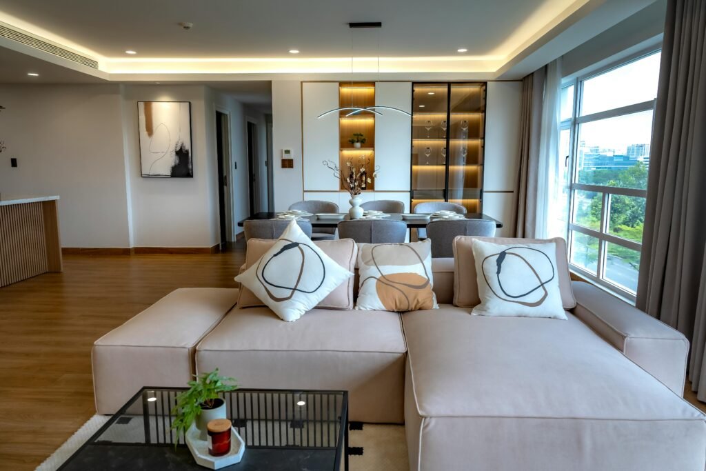 pexels-photo-33326586-33326586 Stylish and spacious living room with a contemporary design, featuring plush seating and chic accents.